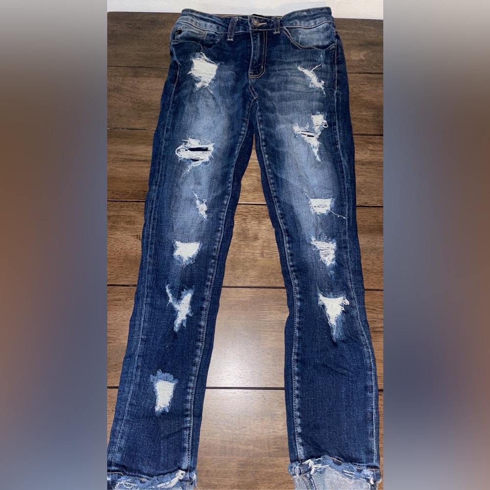 Ripped blue jeans.